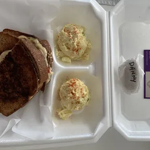 Pimento cheese grilled cheese with fried green tomato and a side of potato salad.  Also the staff put a dog cookie in my order for my puppy!