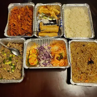 Beef bulgogi, spicy pork, japache, kimchi and cabbage, steamed rice and gyoza/eggrolls.