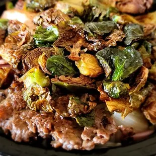 Large bowl - Yam noodles, crunchy tofu, grilled salmon, ginger beef, crispy Brussel sprouts , pickled onions.