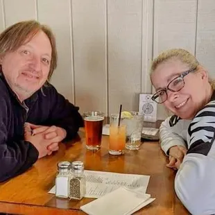 Sandy and I enjoying drinks as we wait for our food to arrive.
