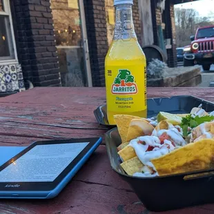 Chicken nachos and pineapple jarrito