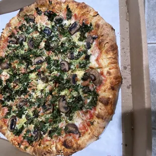 a whole pizza in a box