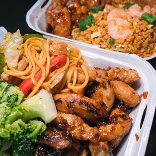 two takeout containers of food