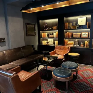 a living room with leather furniture