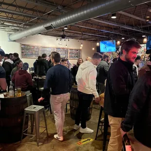 a crowd of people at a bar