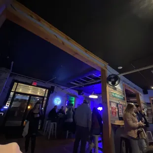 a group of people sitting at a bar