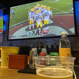 a football game being played on a big screen