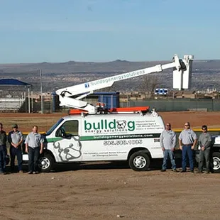 Some of the BES crew and our work vehicles