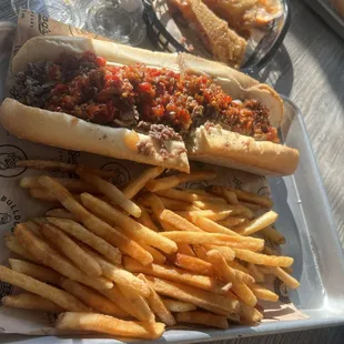 Mushroom steak sandwich with cherry pepper relish. And salt and vinegar fries