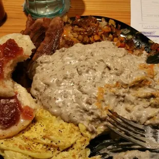 Breakfast grub a dub! Chicken Fried Steak, Sausage Gravy, Hash Browns, 2 Eggs, &amp; a Biscuit.