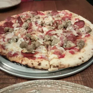 The carnival sausage, pepperoni, bacon.