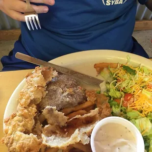 a plate of food and a salad