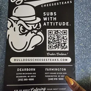 a hand holding a sign