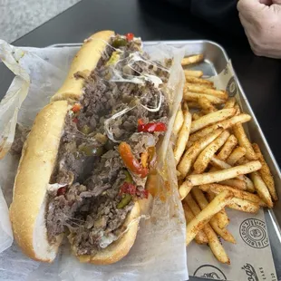 Classic cheesesteak with hot peppers and Side Cajun Fries