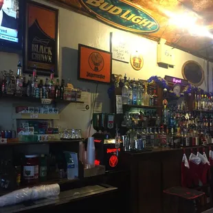 a bar with shelves of liquor