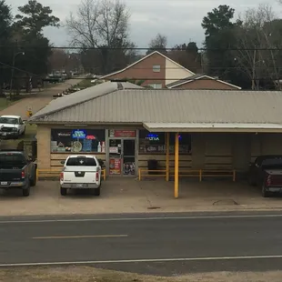 a car parked in front of a gas station