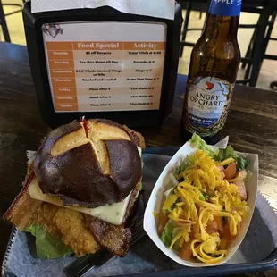 Custom crispy chicken, bacon, pepper jack on a pretzel bun with side salad!