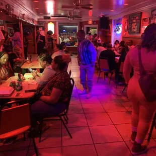 a group of people sitting at tables