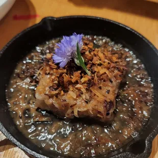 a bowl of beef with gravy