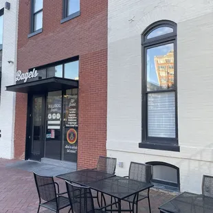Outdoor entrance with outdoor dining furniture.