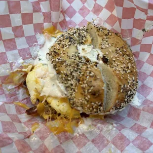 bacon egg and cheese on everything bagel with scallion smear