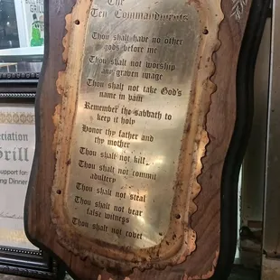 a plaque on a window sill