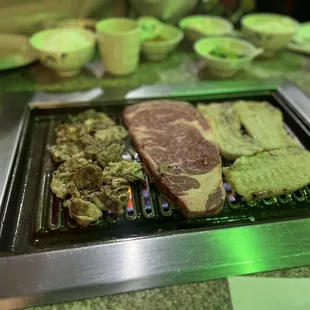 beef and vegetables on the grill