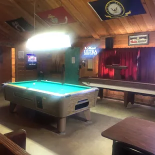 a billiards room with a pool table