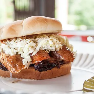 Bovine &amp; Swine: Smoked Brisket &amp; Sausage smothered in slaw.