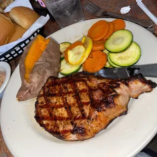 Grill pork chop with seasonal veggies and baked sweet potato!