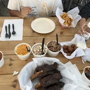 Beef ribs, beans, mac, Cole slaw, brisket, pulled pork, hush puppy, fries
