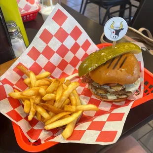 a basket of fries and a pickle