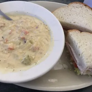 Turkey sandwich with cheesy bacon and potato soup as the daily special
