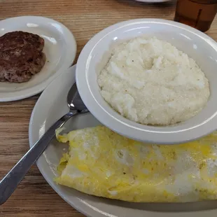 Mushroom omelet with grits and sausage patty