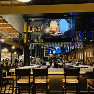 a bar with a large screen