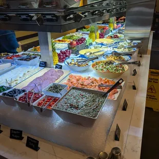 Right side featuring veggie and pasta salads.