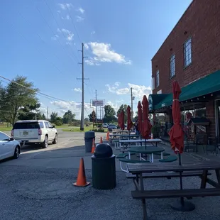  parking lot with tables and umbrellas