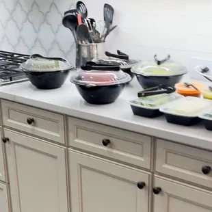 Sides, guacamole, onions,cilantro, limes and salsa.