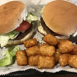 two burgers and tater tots