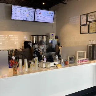 a coffee shop counter with coffee machines