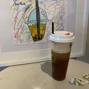 a cup of iced coffee on a table