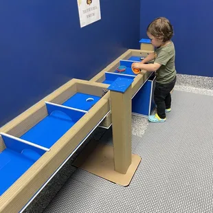 Indoor water table activity. Set up with smocks and shoes to keep your feet dry while playing.