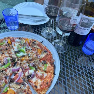 Supreme pizza with Red Wine