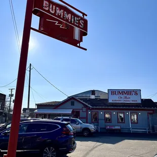 cars parked in front of a business