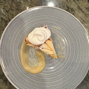 Italian apple cake with a tart Rubinette apple compote, pine nuts, and Chantilly whipped cream.