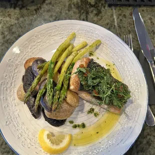 Wild caught PNW King salmon pan-seared, skin on, fingerling potatoes, and asparagus.