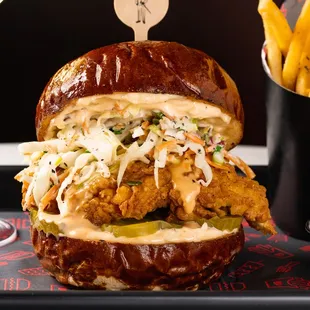 Taste of the South 
Fried Mary&apos;s Free-Range Chicken, House-Made Cabbage Slaw, Pickles, House-Made Chipotle Aioli, Toasted Pretzel Bun.