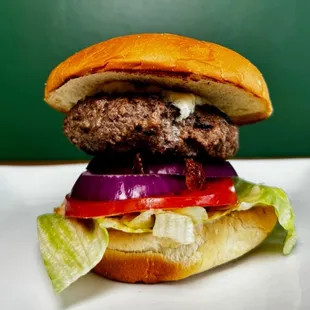 Black &amp; Bleu
Cajun Patty, Bleu Cheese Crumbles, Lettuce, Tomato, Red Onion, Blue Cheese Sauce