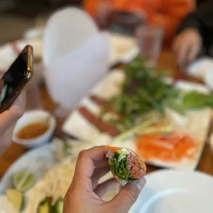 a person taking a picture of their food