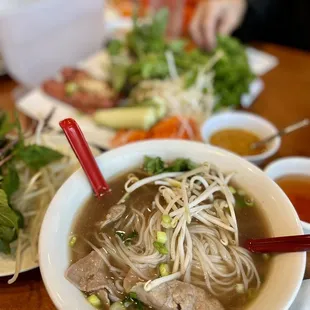 a bowl of soup with meat and vegetables